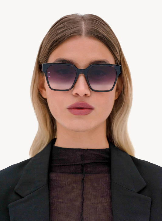 Model front view of Zamora angled square sunglasses in black tortoiseshell
