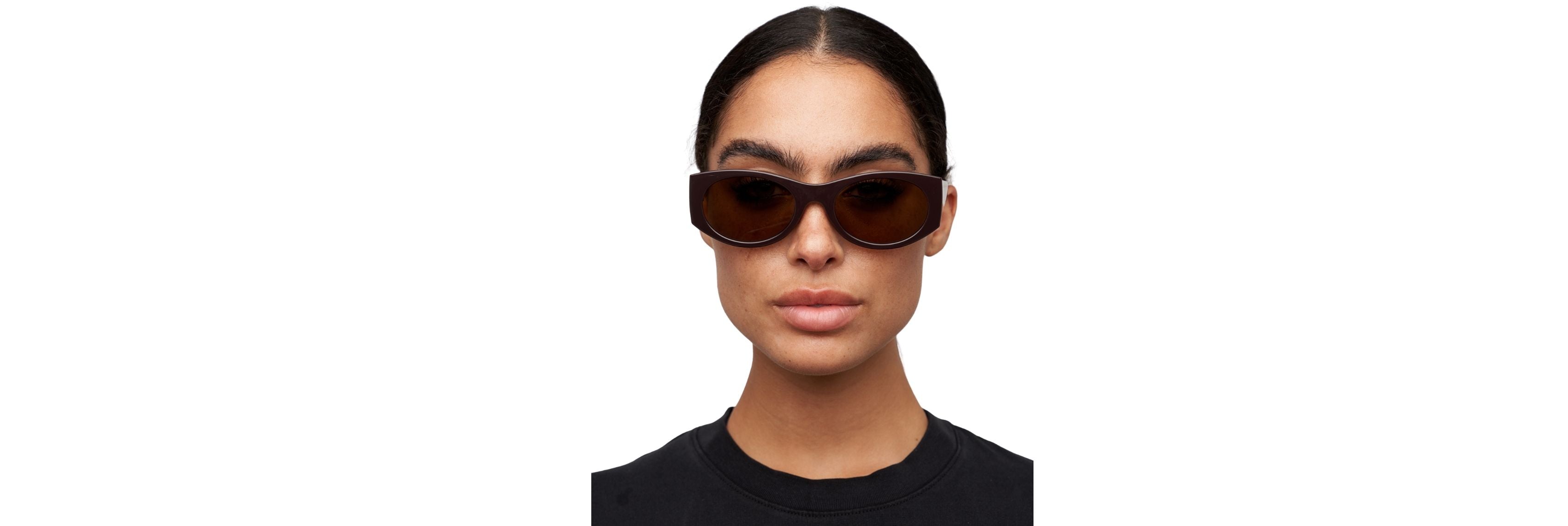 Close-up of a woman adjusting sunglasses on her nose bridge, showing the temple arms and pad area for a proper fit