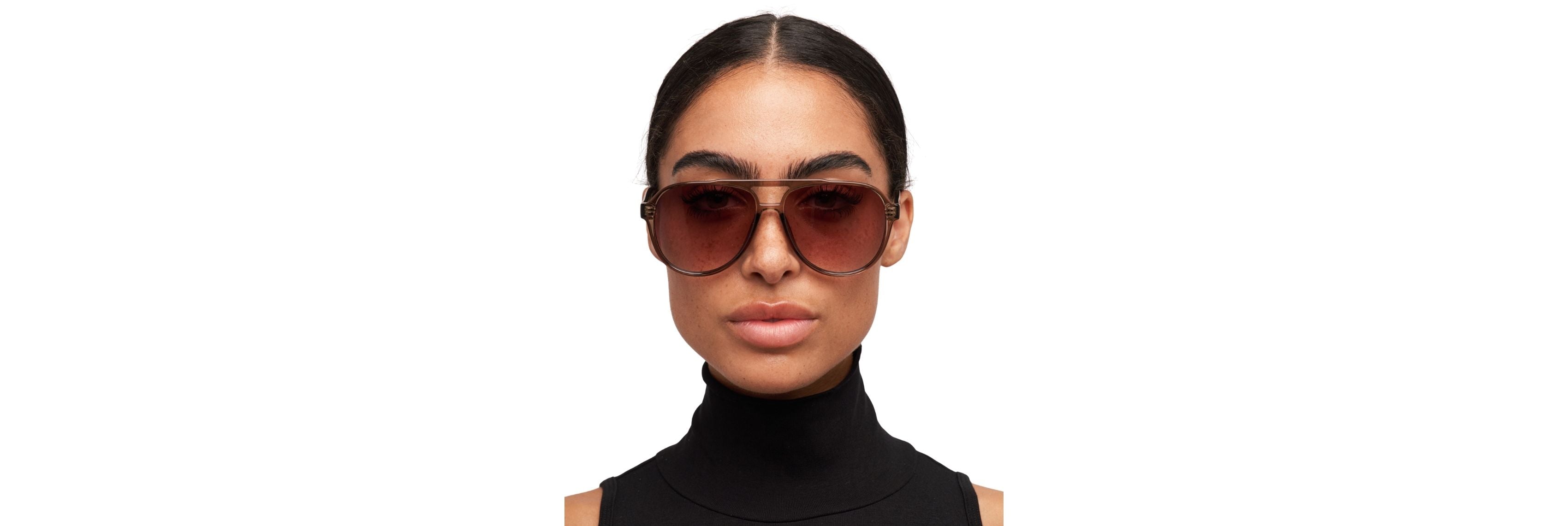 Close-up of sunglasses sliding into a structured hard case beside a soft vegan pouch and a car visor clip—three common storage options side by side.