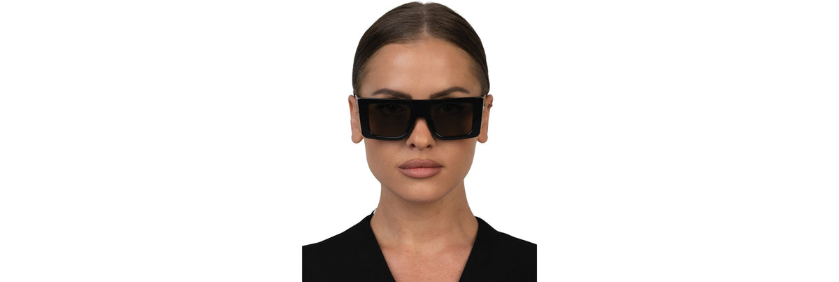 Close-up of sunglasses resting comfortably on a model’s nose bridge without red marks, showing even weight distribution across the pads.
