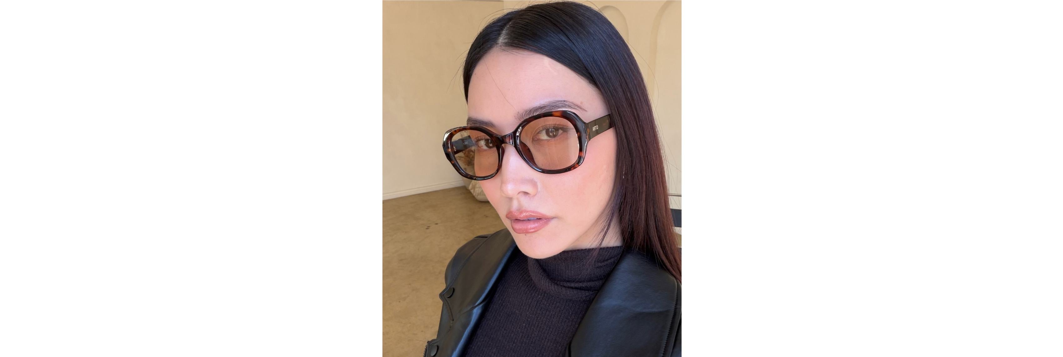 Close-up of two sunglasses on a table—one slim metal frame with adjustable silicone pads and one sculpted acetate frame with a saddle bridge—showing how each contacts a low bridge