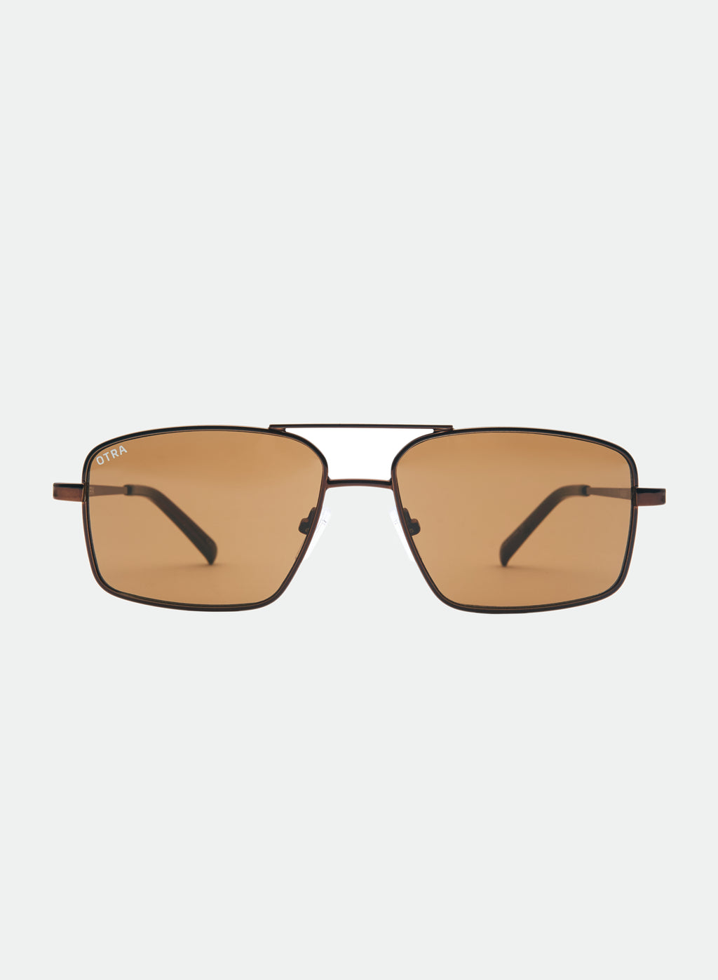 Otra Eyewear - NASH - Chocolate/Brown - Front view of NASH sunglasses in Chocolate/Brown featuring a sleek chocolate metal square aviator frame, warm brown lenses, and a refined double-bridge design, displayed against a clean light grey background. A modern aviator style with lightweight construction and timeless everyday appeal.