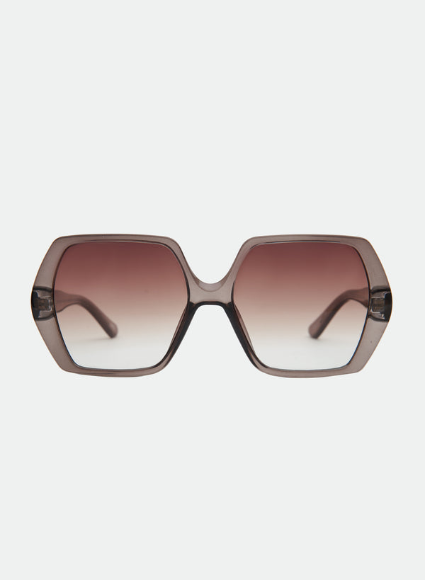 Otra Eyewear-Fleur - Transparent Olive - Front view of Fleur sunglasses featuring a vintage-inspired oversized square transparent olive green frame and warm brown gradient lenses, displayed against a clean light grey background.