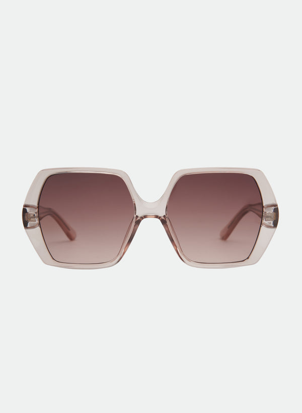 Otra Eyewear- Fleur - Transparent Taupe - Front view of Fleur sunglasses featuring a vintage-inspired oversized square transparent taupe frame and warm brown gradient lenses, displayed against a clean light grey background.