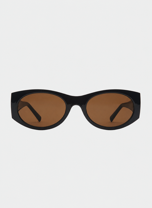 Otra Eyewear - GRACE - Dark Chocolate/Brown - Front view of GRACE sunglasses in Dark Chocolate/Brown featuring a glossy dark chocolate oval frame, warm brown lenses, and a softly curved silhouette, displayed against a clean light grey background. A timeless everyday style designed for versatile wear with full UV400 protection.