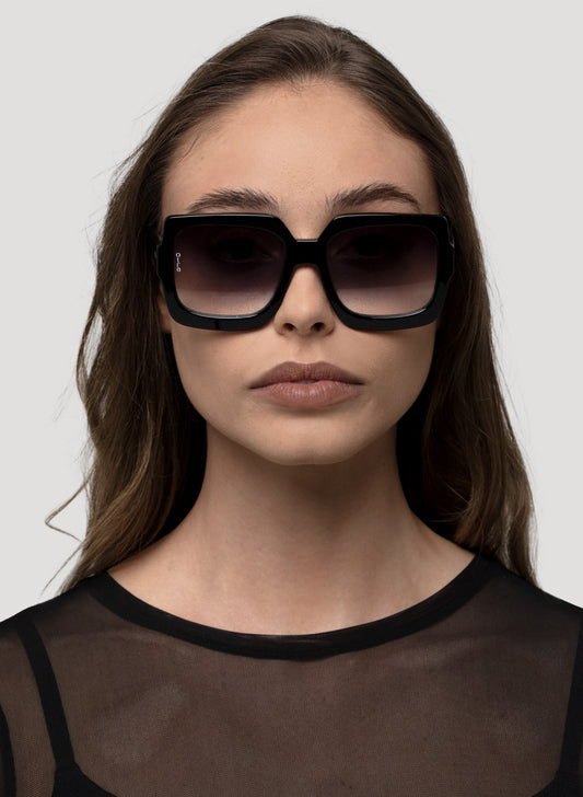 Model wearing Luna oversized sunglasses in black 