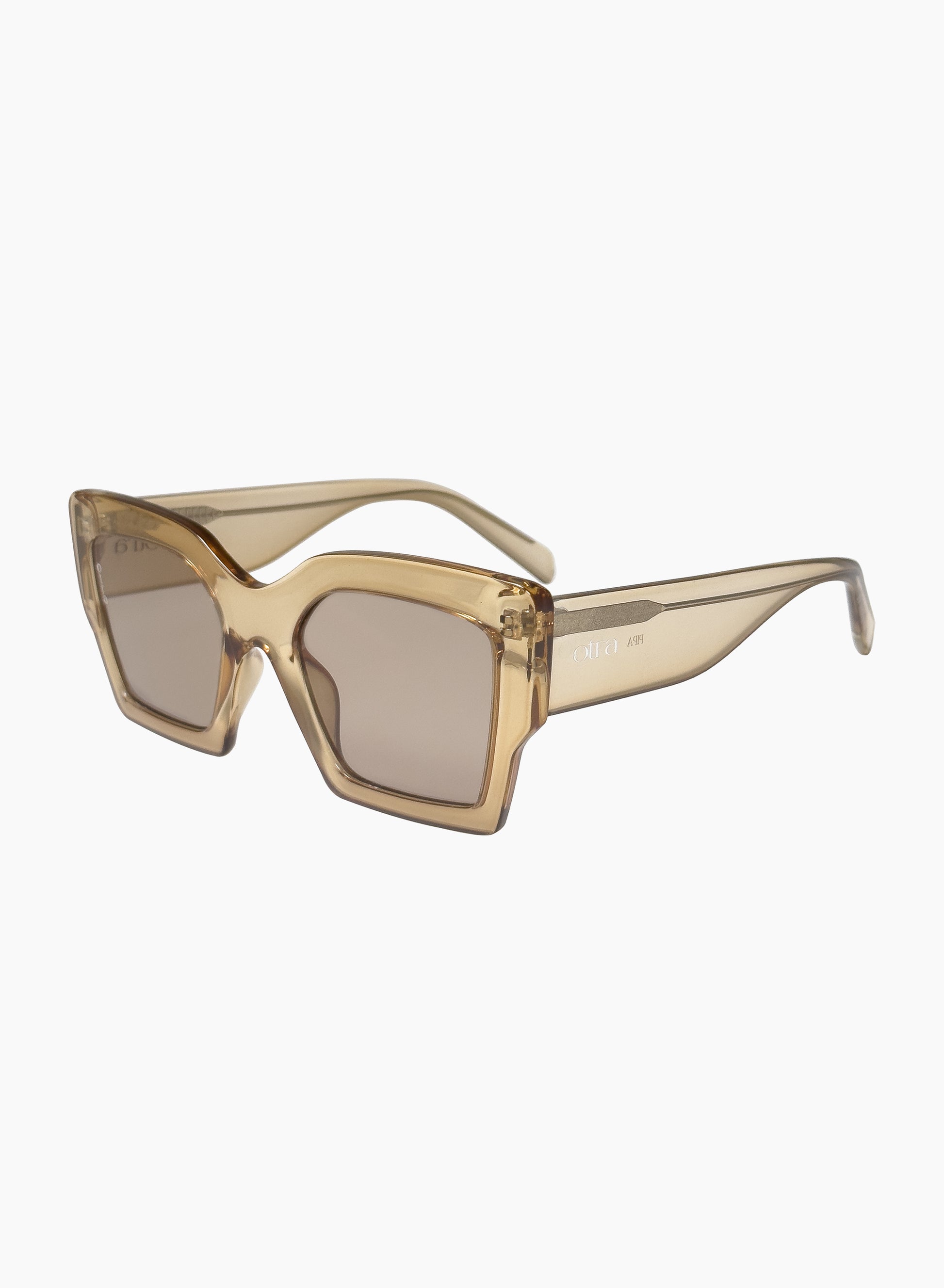 Side view of Pipa oversized cateye sunglasses in transparent gold