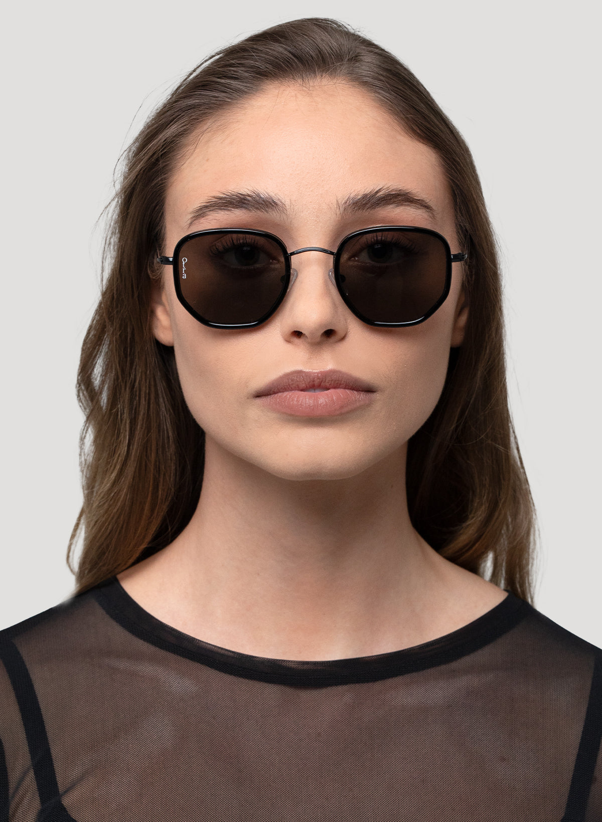 Model wearing Rectangular Tate glasses in black lenses with black frame