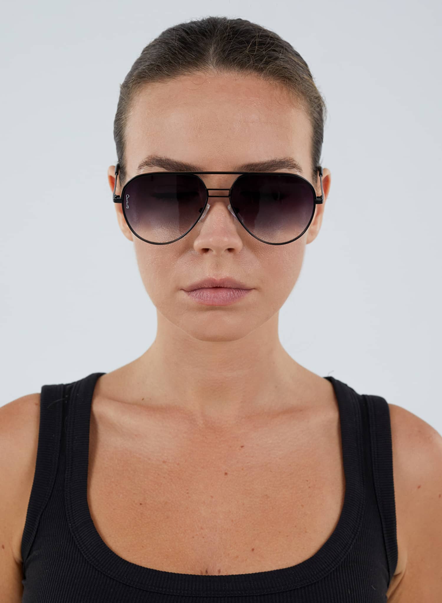 Model wearing Transit black aviator sunglasses