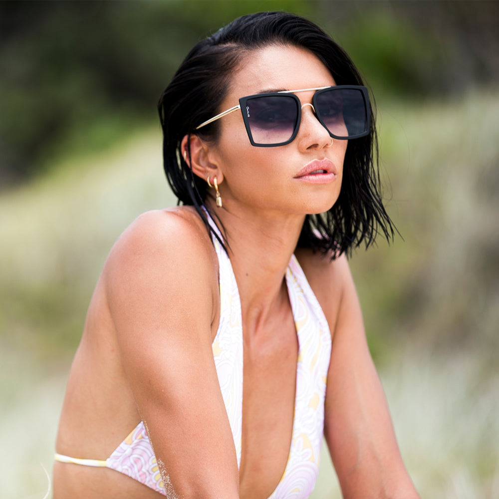 Model wearing Velda oversized square sunglasses in black