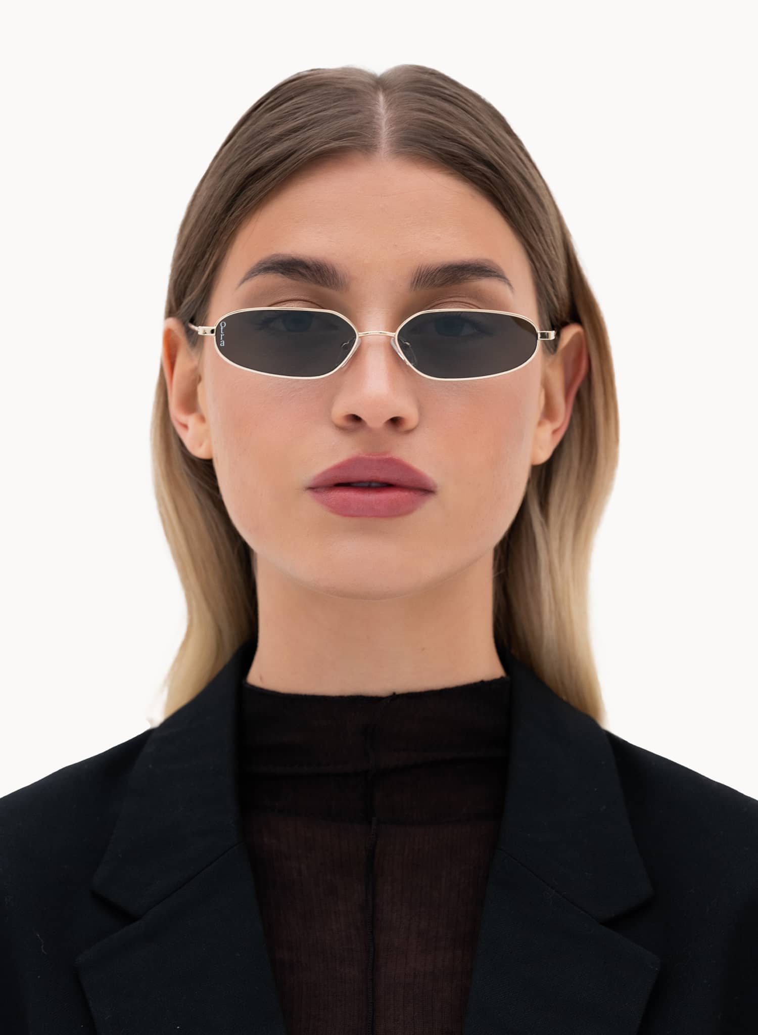 Model wearing Drew metal sunglasses with gold metal frame and green lenses