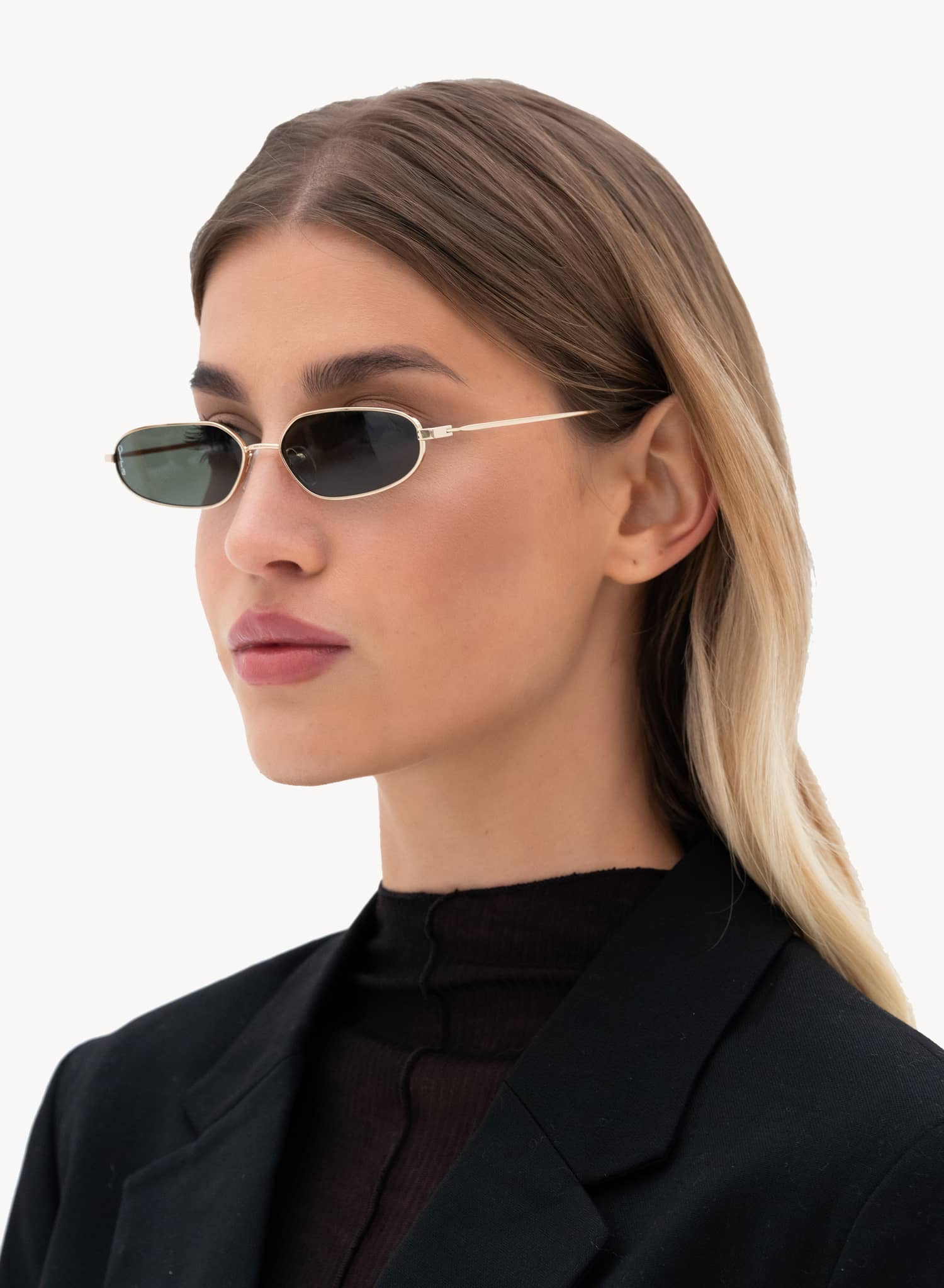 Model side view Drew metal sunglasses with gold metal frame and green lenses