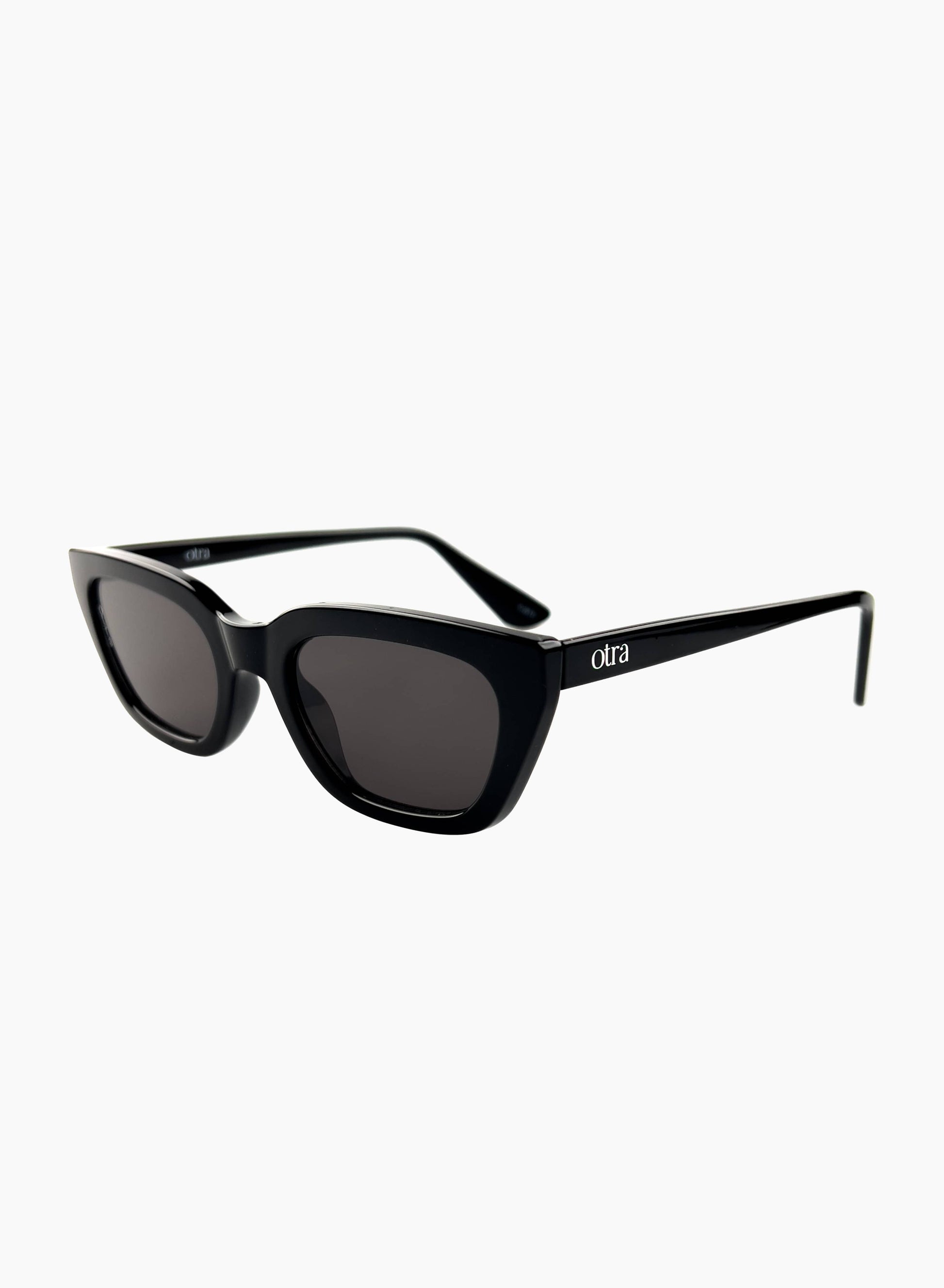 Side view of Nove sunglasses featuring a black cat eye frame and black lenses