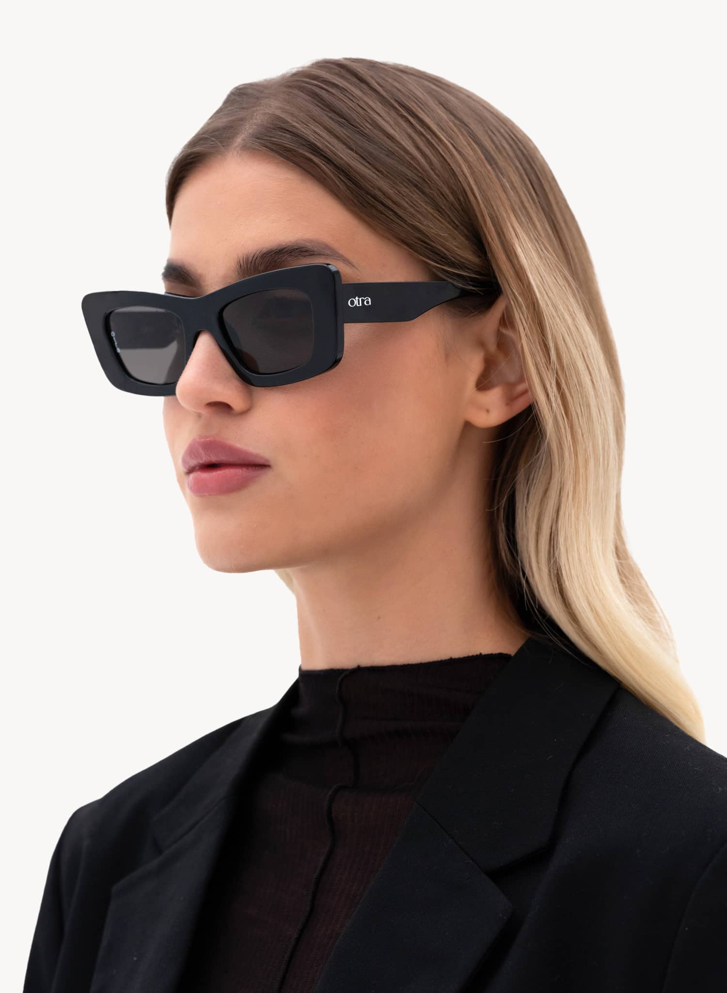 Model wearing Zoe thick cat eye sunglasses in black